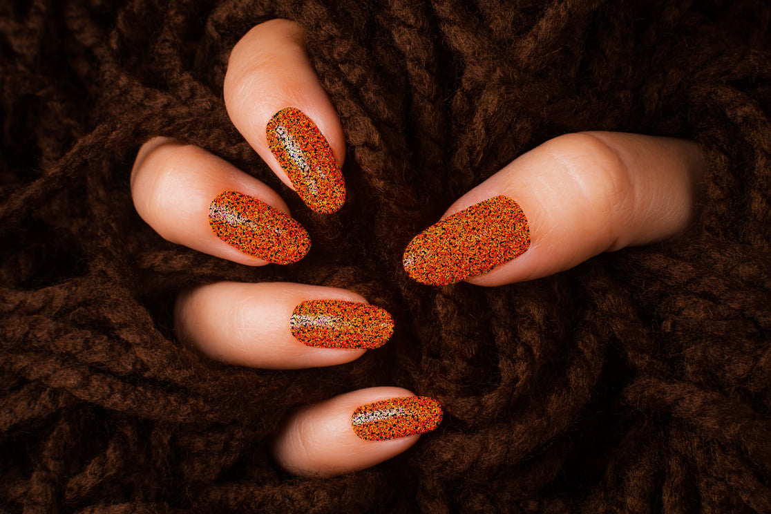 orange glittered nails